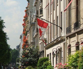 Candian flag hanging from a building