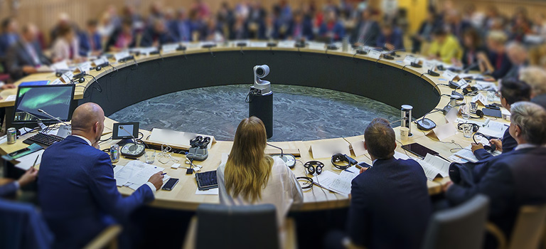 People sitting at a round conference table
